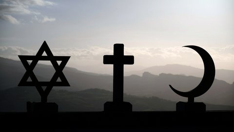 The three symbols of Judaism (Star of David), Christianity (cross), and Islam (crescent moon) against a mountain range