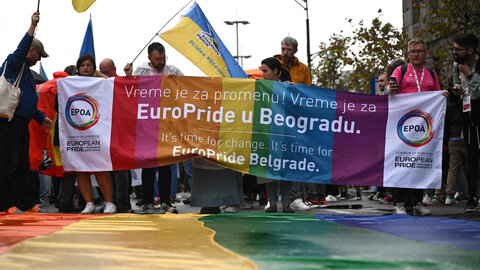 Participants holding banner at Europride Parade 2022 in Belgrade 